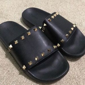 Black stud slip ons